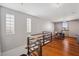 Second floor loft with hardwood floors, glass block windows, and a desk at 5659-5657 Shore S Blvd, Gulfport, FL 33707