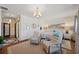 Bright main bedroom with seating area, beach-themed decor, and access to other rooms at 5659-5657 Shore S Blvd, Gulfport, FL 33707