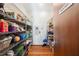 Well-organized pantry with door and shelving provides ample space for storage and food at 5659-5657 Shore S Blvd, Gulfport, FL 33707