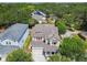 Aerial view of a charming home nestled among lush greenery at 6022 S Elkins Ave, Tampa, FL 33611