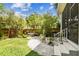 Lush backyard featuring beautiful landscaping, vibrant flowers, and a peaceful atmosphere at 6022 S Elkins Ave, Tampa, FL 33611