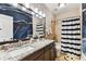 A well-decorated bathroom features a tub, a granite vanity, and a sink at 6022 S Elkins Ave, Tampa, FL 33611