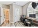 Neutral toned room with hardwood floors and desk at 6022 S Elkins Ave, Tampa, FL 33611