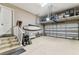 Bright two car garage featuring epoxy floors, ample storage and access to interior stairwell at 6022 S Elkins Ave, Tampa, FL 33611