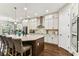 Spacious kitchen with large island, stainless appliances, and white cabinetry at 6022 S Elkins Ave, Tampa, FL 33611