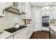 Close up of a modern kitchen with granite countertops and stainless steel appliances at 6022 S Elkins Ave, Tampa, FL 33611