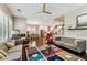 Open living room with hardwood floors that seamlessly connects to the kitchen area at 6022 S Elkins Ave, Tampa, FL 33611