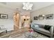 Relaxing living room with stylish decor, modern furniture and wood look tile floors at 6022 S Elkins Ave, Tampa, FL 33611