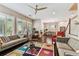 Open-concept living room with hardwood floors and abundant natural light at 6022 S Elkins Ave, Tampa, FL 33611