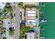 Birds-eye view of condos along the water featuring pools, docks, and lush landscaping at 620 Bayway Blvd # 1, Clearwater, FL 33767