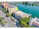 Aerial view of a waterfront condo with boat docks on the water at 620 Bayway Blvd # 1, Clearwater, FL 33767