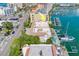 Aerial shot of a waterfront condo with pools and boat docks on a sunny day at 620 Bayway Blvd # 1, Clearwater, FL 33767