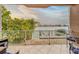 Balcony seating area with chairs and table overlooking the waterfront and boat docks at 620 Bayway Blvd # 1, Clearwater, FL 33767