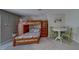 Bedroom with charming bunk beds and small table with chairs. Natural light included at 620 Bayway Blvd # 1, Clearwater, FL 33767