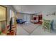 Relaxing bedroom featuring a futon, bunk beds, and a dining table, perfect for guests at 620 Bayway Blvd # 1, Clearwater, FL 33767