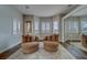 Bedroom featuring bay window, chairs, and a view at 620 Bayway Blvd # 1, Clearwater, FL 33767