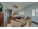 Large bedroom showing seating, staircase, a bay window, and wood flooring at 620 Bayway Blvd # 1, Clearwater, FL 33767