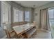 Bright dining area featuring a wooden table with bench seating and water views at 620 Bayway Blvd # 1, Clearwater, FL 33767