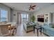 Comfortable living room with water view, tile flooring, ceiling fan, and entertainment center at 620 Bayway Blvd # 1, Clearwater, FL 33767