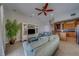Comfortable living room offers a cozy seating area with lots of natural light and views into the kitchen at 620 Bayway Blvd # 1, Clearwater, FL 33767
