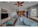 Inviting living area featuring stylish decor, tile flooring, and an open layout to the kitchen and dining area at 620 Bayway Blvd # 1, Clearwater, FL 33767