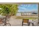 Waterfront patio featuring beautiful water views, outdoor furniture, and lush landscaping at 620 Bayway Blvd # 1, Clearwater, FL 33767