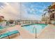 Community pool area overlooking water, equipped with lounge chairs and scenic views at 620 Bayway Blvd # 1, Clearwater, FL 33767