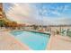 Waterfront pool area featuring comfortable loungers and city skyline in the background at 620 Bayway Blvd # 1, Clearwater, FL 33767