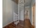Interior shot of a white, modern, spiral staircase inside the home at 620 Bayway Blvd # 1, Clearwater, FL 33767
