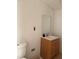 Bathroom featuring a single sink vanity with wood cabinets and a framed mirror at 6206 Paul Buchman Hwy, Plant City, FL 33565