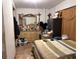 Bedroom featuring a large dresser with a mirror and a striped comforter on the bed at 6206 Paul Buchman Hwy, Plant City, FL 33565