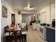 View of kitchen and dining area with a table for six and a glimpse into the adjacent living room at 6206 Paul Buchman Hwy, Plant City, FL 33565