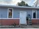 Exterior home featuring a blue and brick facade at 6206 Paul Buchman Hwy, Plant City, FL 33565