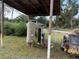 A covered area featuring water conditioning tanks at 6206 Paul Buchman Hwy, Plant City, FL 33565