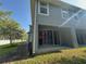 Exterior view of the home featuring a patio and backyard at 6304 Parkside Meadow Dr, Tampa, FL 33625