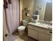 Bathroom featuring a vanity, toilet, tub and shower combination with a curtain at 6304 Parkside Meadow Dr, Tampa, FL 33625