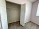 This bedroom features a closet, fresh carpet, neutral walls, and window at 6304 Parkside Meadow Dr, Tampa, FL 33625