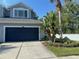 Charming two-story home with a two car garage and well manicured lawn at 6304 Parkside Meadow Dr, Tampa, FL 33625