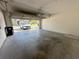 Large two car garage with epoxy flooring, and automatic garage door opener at 6304 Parkside Meadow Dr, Tampa, FL 33625