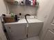 Laundry room with a white washer and dryer at 6304 Parkside Meadow Dr, Tampa, FL 33625