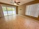 Bright living area with tiled flooring, sliding glass doors, and a ceiling fan at 6304 Parkside Meadow Dr, Tampa, FL 33625