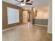 Open concept living room with tile flooring, open floorplan, and neutral colors at 6304 Parkside Meadow Dr, Tampa, FL 33625
