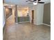 Open concept living room with tile flooring, open floorplan, and neutral colors at 6304 Parkside Meadow Dr, Tampa, FL 33625