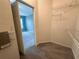 Walk-in closet with wire shelving and view of primary bedroom at 6304 Parkside Meadow Dr, Tampa, FL 33625