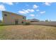 Expansive backyard featuring a well-maintained fence and ample space for outdoor activities on a sunny day at 6708 Hazelnut Spice Dr, Ruskin, FL 33573
