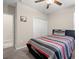 Comfortable bedroom with neutral walls, a ceiling fan, and carpet; relaxing and inviting space at 6708 Hazelnut Spice Dr, Ruskin, FL 33573