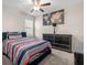 Cozy bedroom with a ceiling fan, neutral walls, carpet, and a well-appointed dresser; comfortable retreat at 6708 Hazelnut Spice Dr, Ruskin, FL 33573