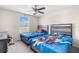 bedroom with playful decor and comfortable twin beds at 6708 Hazelnut Spice Dr, Ruskin, FL 33573
