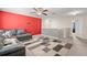 An upstairs bonus room with vibrant accent wall and comfortable seating at 6708 Hazelnut Spice Dr, Ruskin, FL 33573