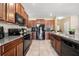 A spacious kitchen featuring updated appliances and ample counter space at 6708 Hazelnut Spice Dr, Ruskin, FL 33573